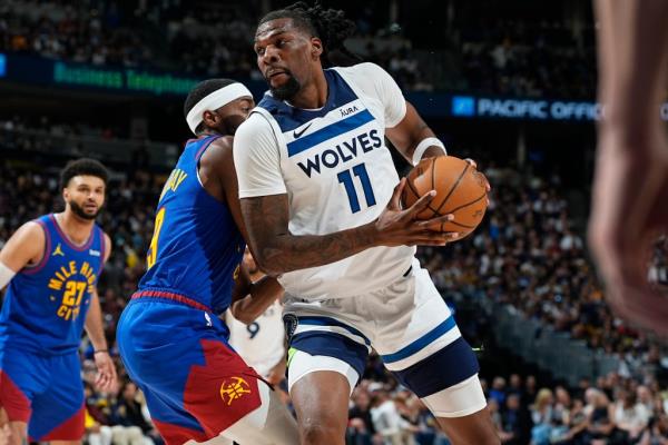 Naz Reid, making a move to the basket, scored 14 of his 16 points in the fourth quarter of the Timberwolves' win.