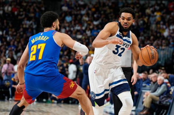 Karl-Anthony Towns drives on Jamal Murray during the Timberwolves' win.