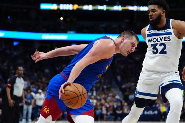 Nikola Jokic drives to the basket during the Nuggets' Game 1 loss to the Timberwolves.