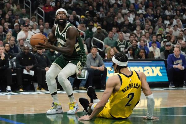 Milwaukee Bucks' Patrick Beverley shoots past Indiana Pacers' Andrew Nembhard during the first half of Game 5 of the NBA playoff basketball series Tuesday, April 30, 2024, in Milwaukee.