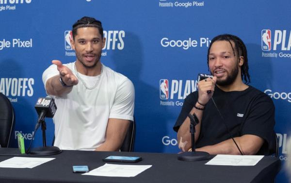 Josh Hart throws a piece of candy to a reporter as Do<em></em>nte DiVincenzo, (left) and Jalen Brunson look on, during a post game press co<em></em>nference after Game 6 of their first-round playoff series against the Sixers on May 2, 2024. 
