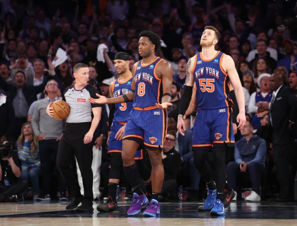 Knicks forward OG Anunoby (8) reacts after New York Knicks guard Jalen Brunson (11) is fouled by Philadelphia 76ers center Joel Embiid (21) in overtime.