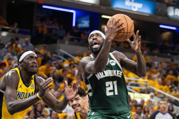 Milwaukee Bucks guard Patrick Beverley (21) shoots the ball while Indiana Pacers forward Pascal Siakam (43) defends during game six of the first round for the 2024 NBA playoffs at Gainbridge Fieldhouse. Mandatory