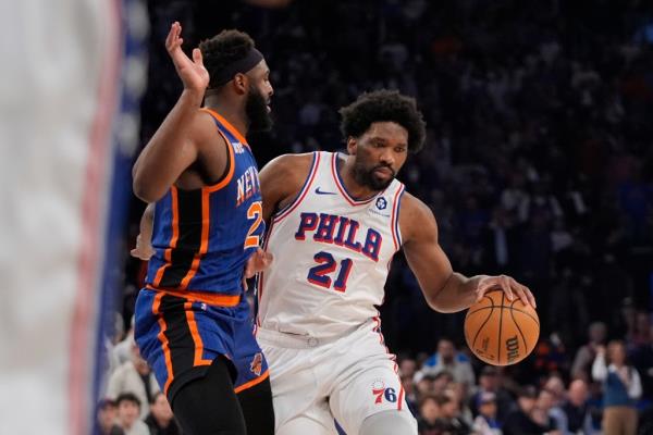 Joel Embiid drives to the basket against Mitchell Robinson during Game 5.