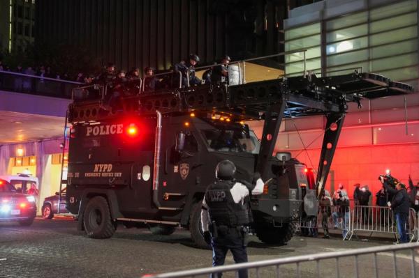 Police use a special vehicle to enter Hamilton Hall