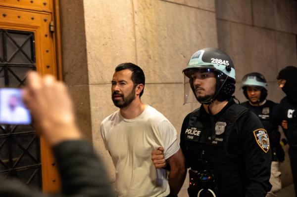 Student protestors being arrested by police and removed from the Columbia University campus