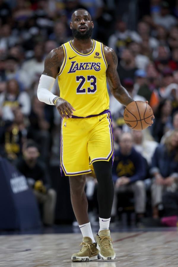 LeBron James #23 of the Los Angeles Lakers brings the ball down the court against the Denver Nuggets in the third quarter during game five of the Western Co<em></em>nference First Round Playoffs at Ball Arena on April 29, 2024 in Denver, Colorado.  