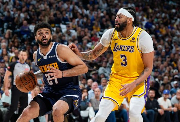 Jamal Murray dribbles to the rim during the Nuggets' Game 4 win over the Lakers on April 29, 2024. 