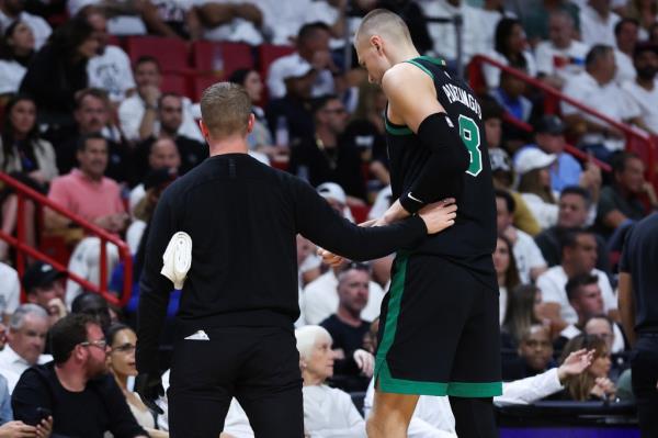 The Celtics' Kristaps Porzingis leaves the game during the second quarter after suffering an apparent injury.