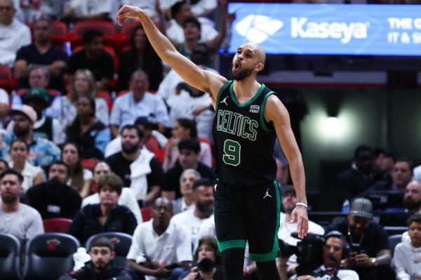 Derrick White of the Celtics reacts after making a basket on his way to 38 points Mo<em></em>nday night in Game 4 against the Heat.