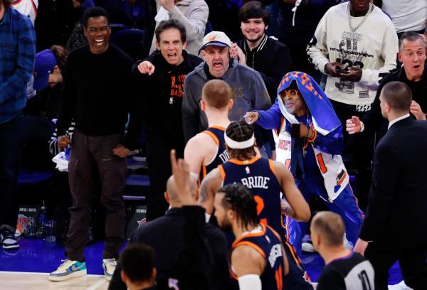 Celebrities Chris Rock, Ben Stiller, Gary Vaynerchuk, and Spike Lee react toward Do<em></em>nte DiVincenzo #0 of the New York Knicks during Game 2.